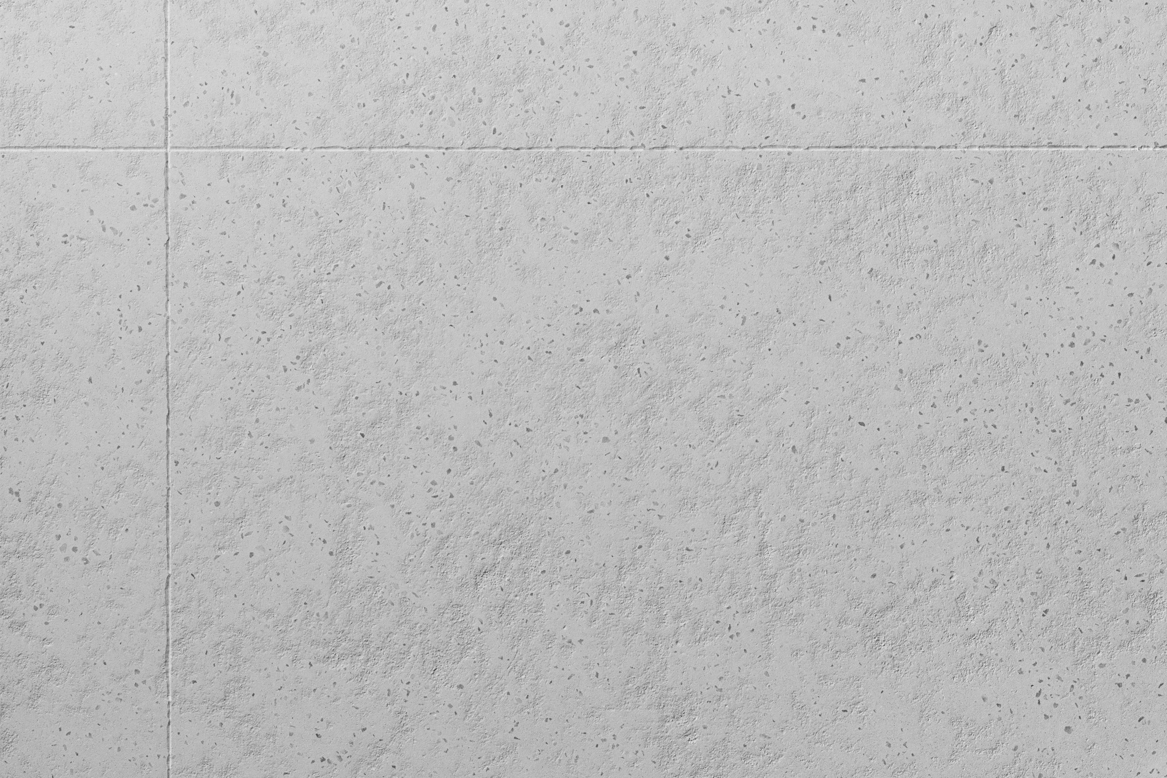 Vaaleanharmaa betonimainen pinta.