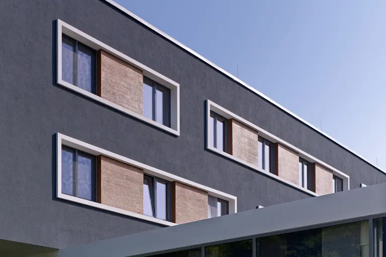 Thermal insulation: exterior shot of an apartment building, anthracite in colour, facade insulated with Sto