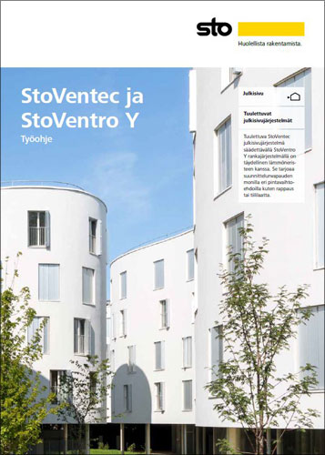 Valkoiset kerrostalot sinistä taivasta vasten